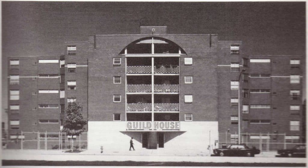 Guild House in Philadelphia by Venturi and Rauch, the ordinary brick block the book analyses as a decorated shed: a plain building carrying a large sign above its entrance.